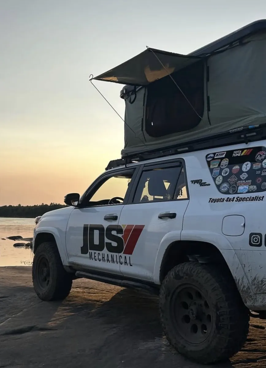 JDS 4Runner beach camp at sunset with rooftop tent.