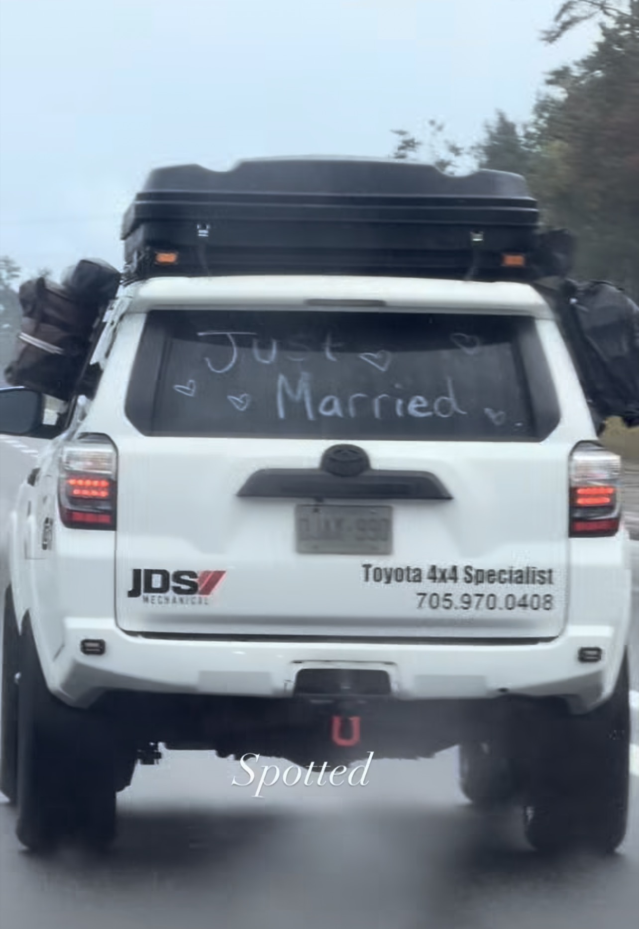 Rear of the JDS Toyota 4Runner with Just Married written on the window.